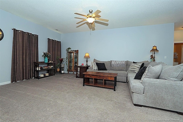 carpeted living room featuring a textured ceiling and ceiling fan