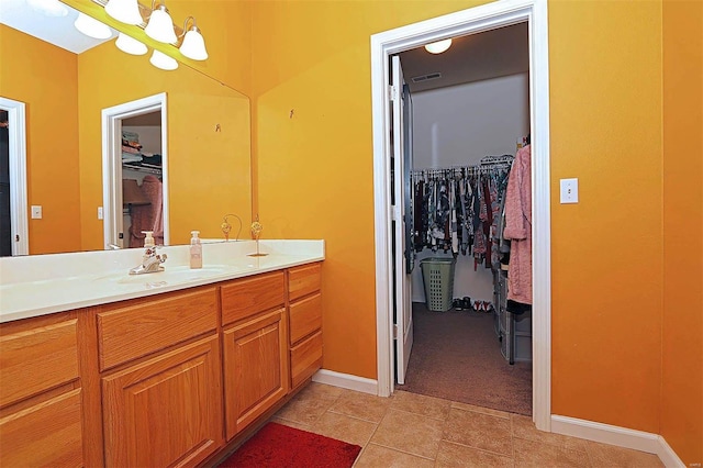 bathroom with tile patterned floors and vanity