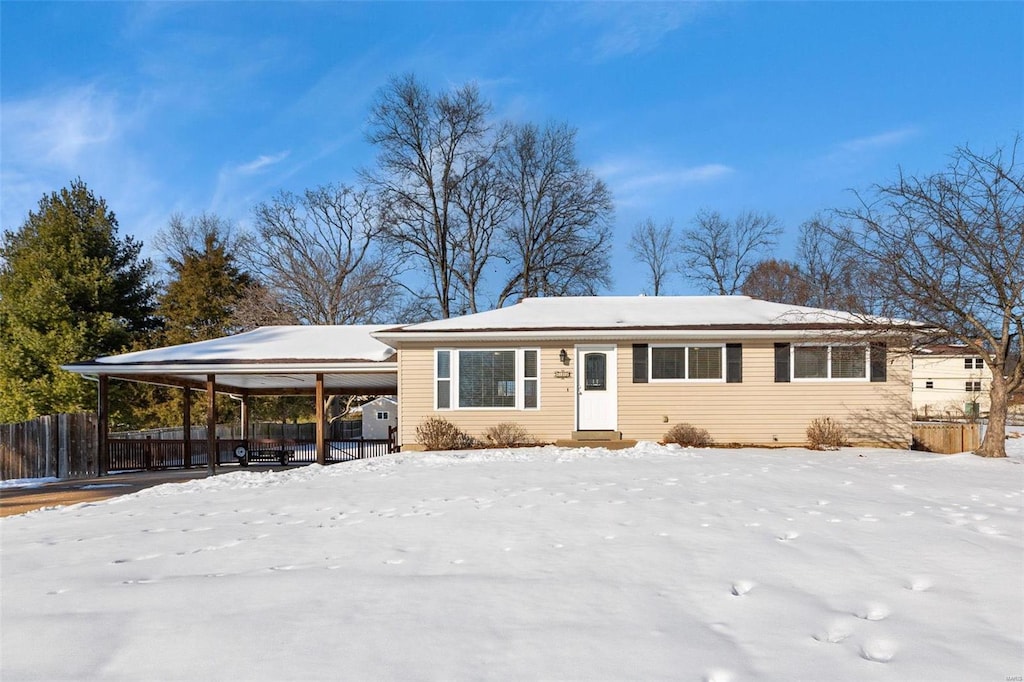 view of front of property with a carport