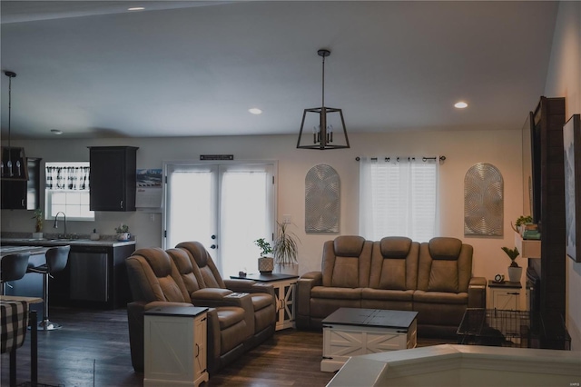 living room with sink and dark hardwood / wood-style floors