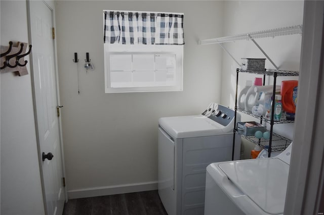 laundry room with dark wood-type flooring and washer and clothes dryer