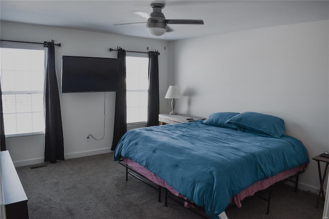 bedroom featuring dark colored carpet and ceiling fan