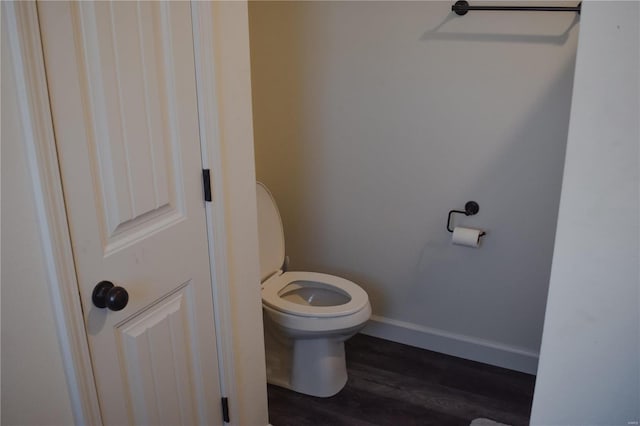 bathroom featuring hardwood / wood-style floors and toilet