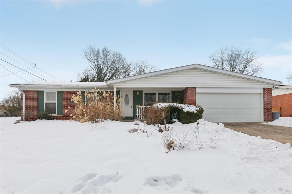 single story home with a garage