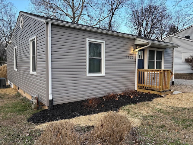 exterior space featuring a lawn and central AC