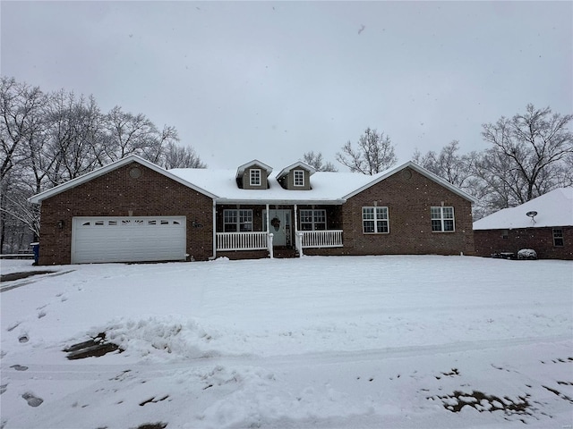 view of front of property featuring a porch and a garage