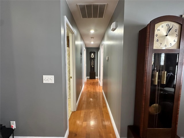 hallway with light wood-type flooring