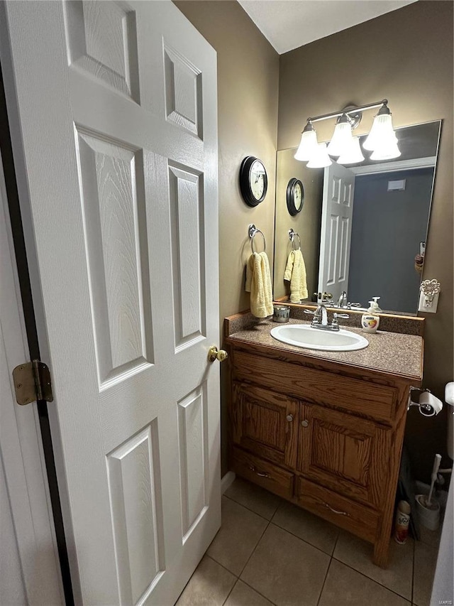 bathroom featuring tile patterned flooring and vanity