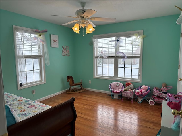 bedroom featuring hardwood / wood-style floors and ceiling fan