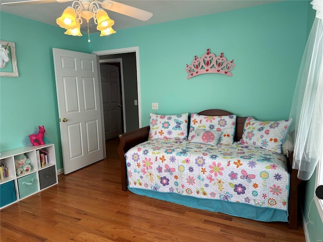 bedroom featuring hardwood / wood-style floors and ceiling fan