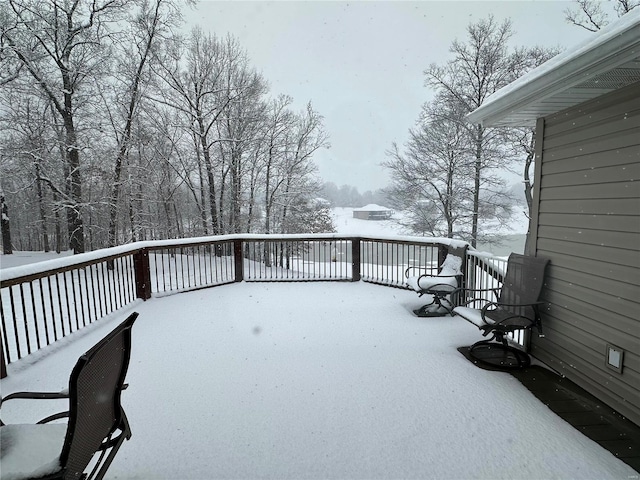 view of snow covered deck