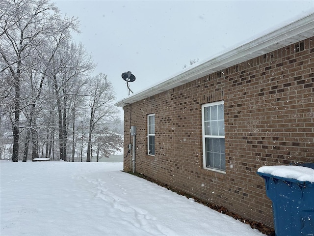 view of snow covered property