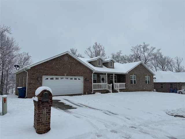 view of front of house with a porch and a garage