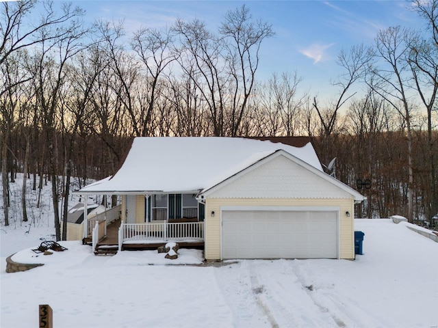 view of front of property featuring covered porch and a garage