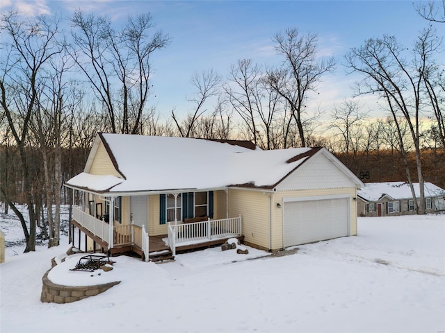 view of front of house featuring a garage and covered porch