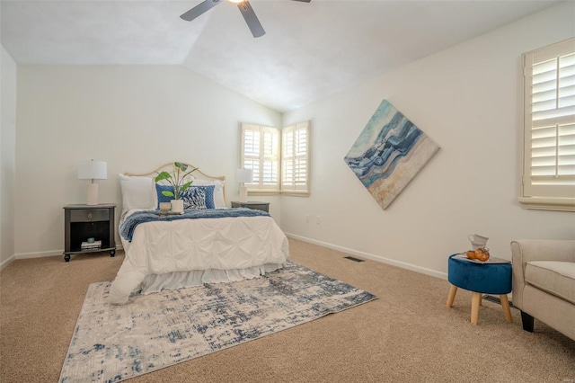 bedroom with multiple windows, ceiling fan, carpet, and vaulted ceiling