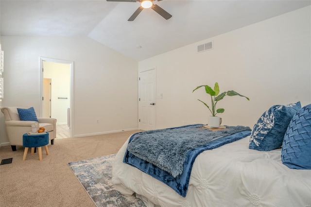 carpeted bedroom with vaulted ceiling and ceiling fan