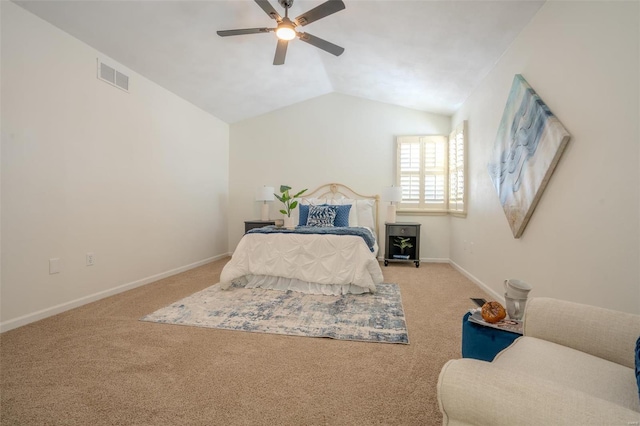 bedroom with ceiling fan, light carpet, and vaulted ceiling