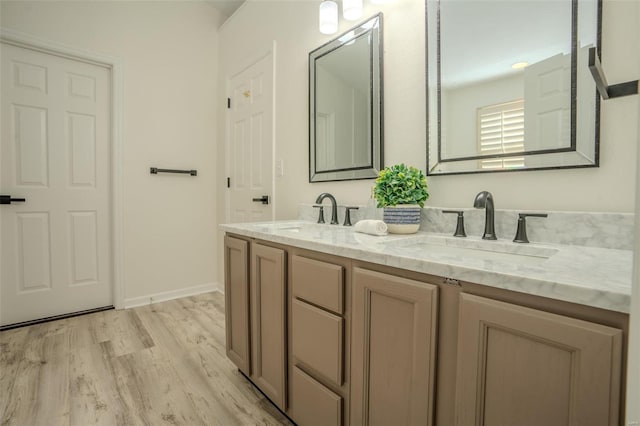 bathroom featuring hardwood / wood-style floors and vanity