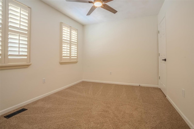 unfurnished room with carpet flooring and ceiling fan