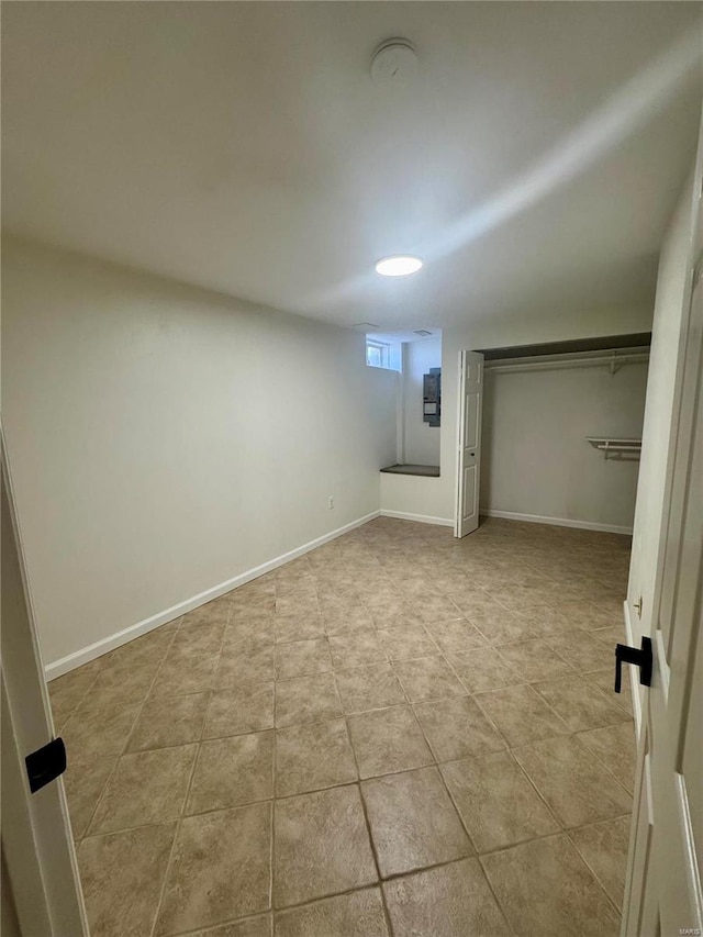 basement featuring light tile patterned floors