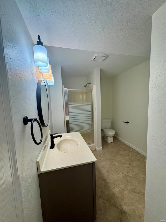 bathroom featuring a textured ceiling, vanity, toilet, and an enclosed shower