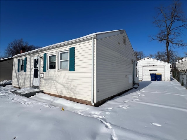 exterior space with a garage and an outdoor structure