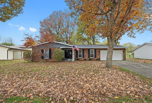 single story home with a garage