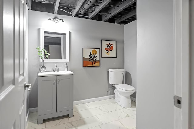 bathroom with toilet and vanity