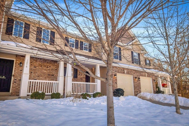 view of front of home with a garage and covered porch