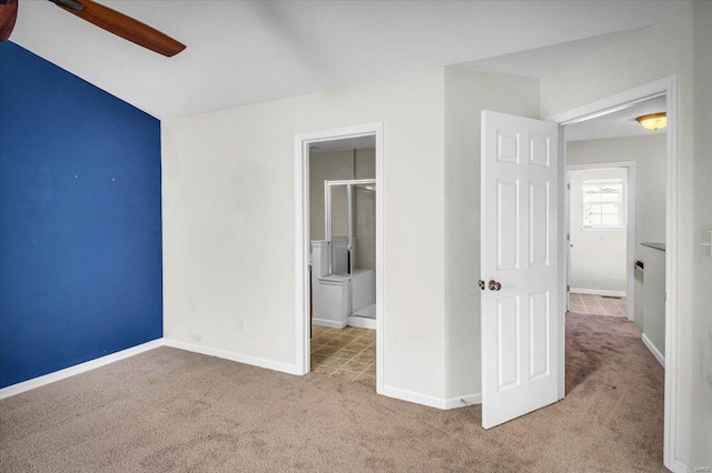 unfurnished bedroom with ceiling fan and light carpet