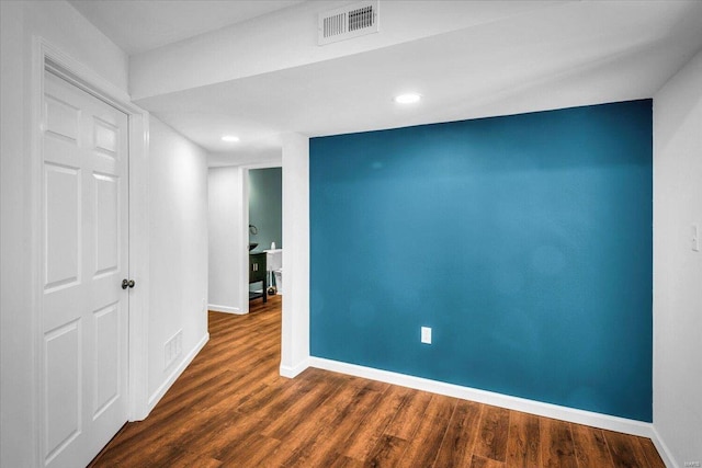 empty room featuring dark wood-type flooring