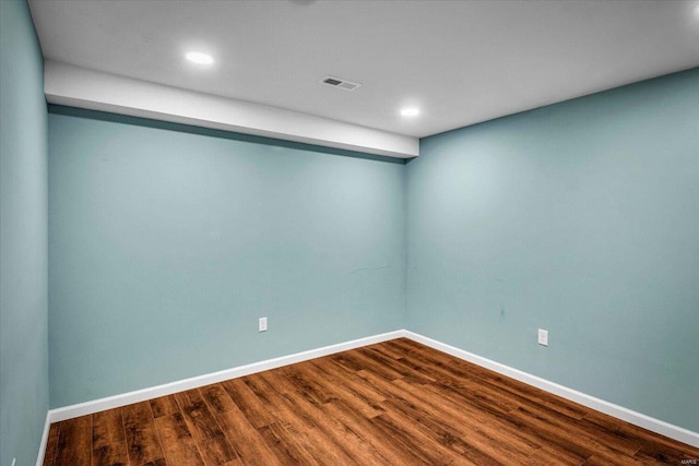 empty room with wood-type flooring