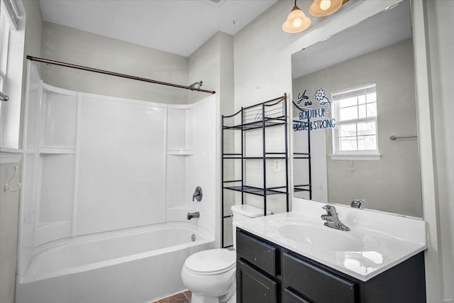 bathroom featuring vanity,  shower combination, and toilet