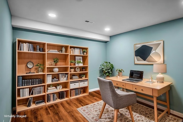 home office featuring recessed lighting, visible vents, baseboards, and wood finished floors