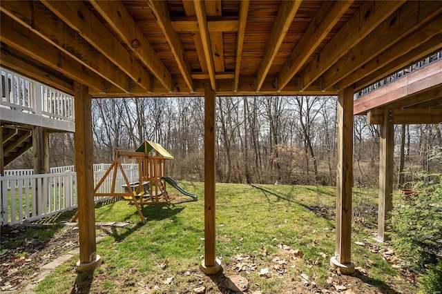 view of yard featuring a playground and fence