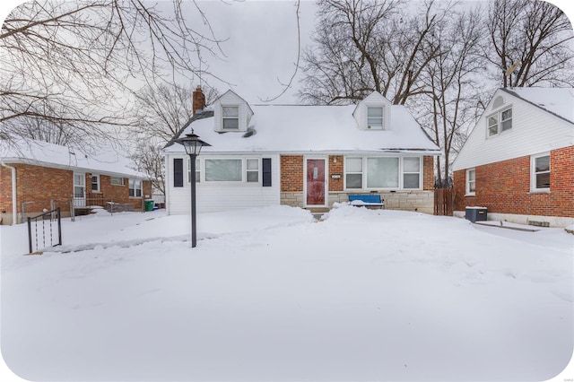 cape cod home with central AC unit