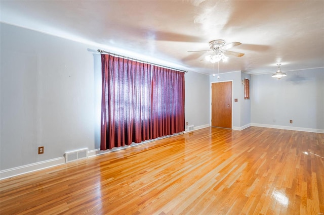 unfurnished room featuring ceiling fan and wood-type flooring