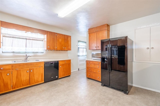 kitchen featuring black appliances and sink