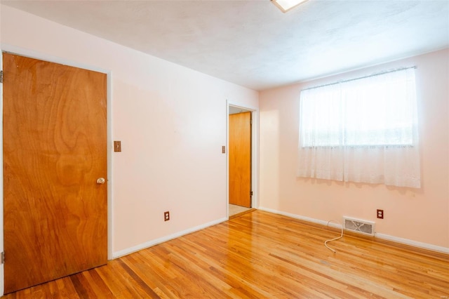 empty room featuring light hardwood / wood-style floors