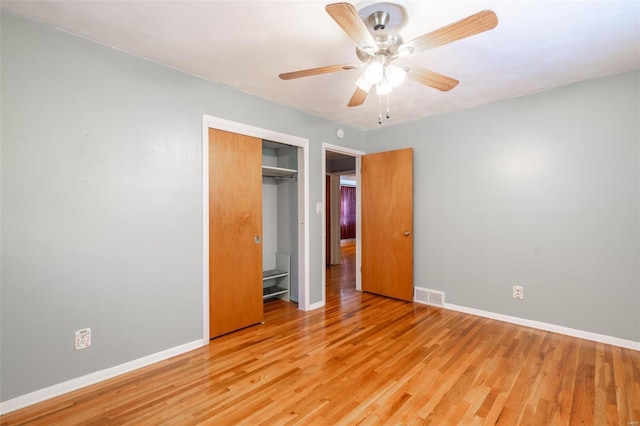 unfurnished bedroom with a closet, ceiling fan, and light hardwood / wood-style flooring