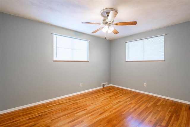 spare room with ceiling fan and light hardwood / wood-style floors