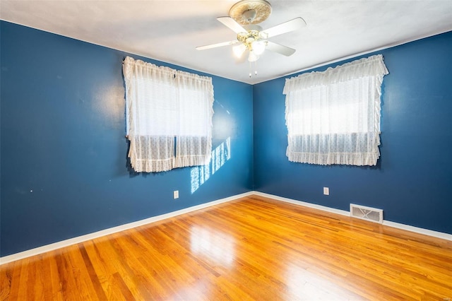 spare room featuring ceiling fan and wood-type flooring