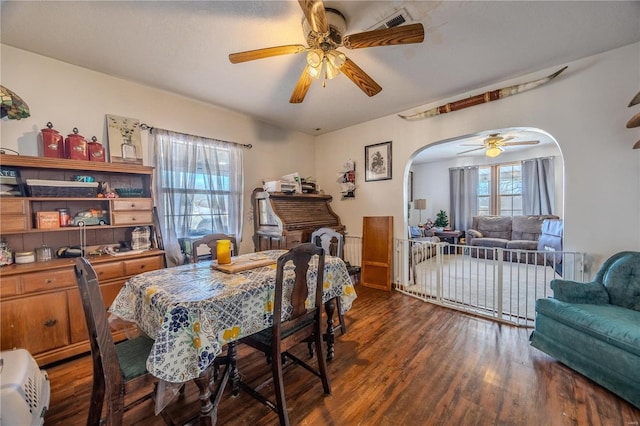 dining room featuring dark hardwood / wood-style floors and ceiling fan