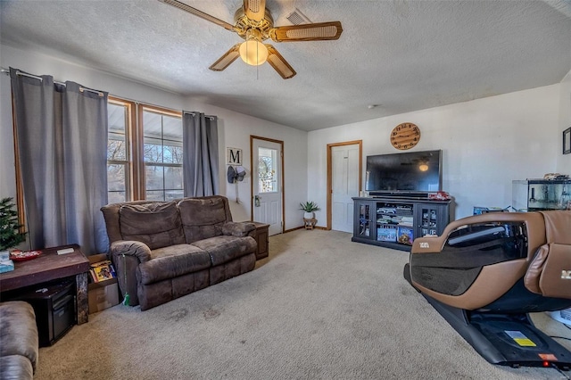 carpeted living room with ceiling fan and a textured ceiling