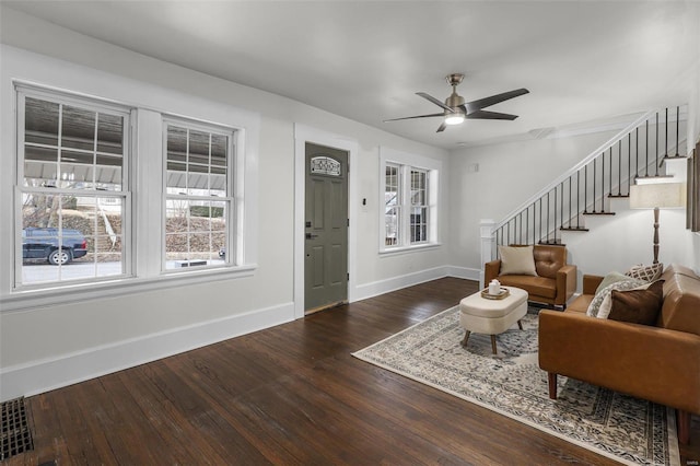 living room with ceiling fan and hardwood / wood-style flooring