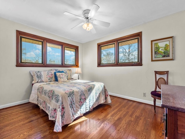 bedroom featuring ceiling fan and dark hardwood / wood-style floors