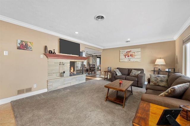 living room featuring a fireplace, carpet floors, and crown molding