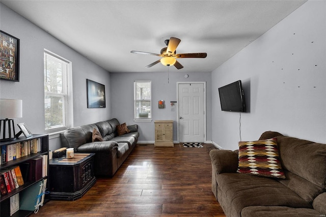 living room with ceiling fan and dark hardwood / wood-style floors