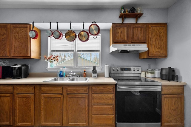 kitchen with stainless steel electric range oven and sink